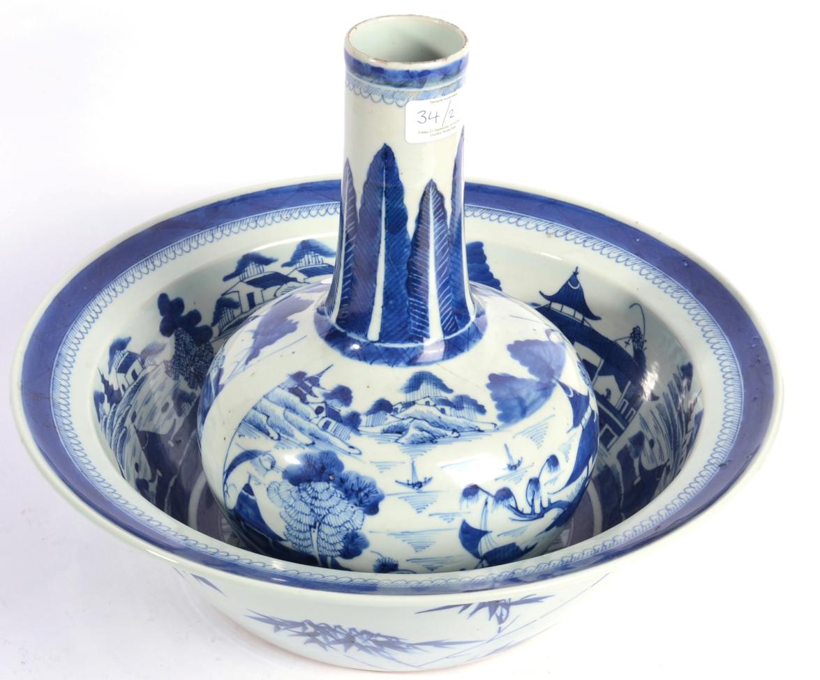 A Chinese Porcelain Guglet and Basin, circa 1800, painted in underglaze blue with river landscapes