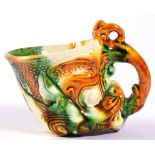 A Chinese Sancai Glazed Pottery Libation Cup, in Ming style, modelled as the head of a mythical