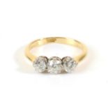 A Diamond Three Stone Ring, graduated old cut diamonds in claw settings, to knife edge shoulders,