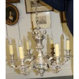 A Silvered Metal Six-Light Electrolier, in 17th century style, with scroll branches, cast with three