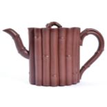 A Yixing Stoneware Teapot and Cover, of oval section modelled as a bound bamboo, with similar