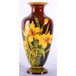 A Doulton Lambeth Faience Baluster Vase, circa 1890, decorated by A Euphemia Thatcher with daffodils