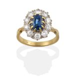 A Sapphire and Diamond Cluster Ring, an oval cut sapphire in a claw setting, within a border of