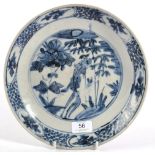 A Swatow Porcelain Saucer Dish, probably 17th century, painted in underglaze blue with a phoenix
