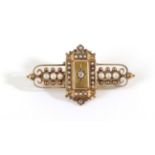 A Victorian Seed Pearl and Diamond Brooch, a star set old cut diamond to a rectangular plaque set