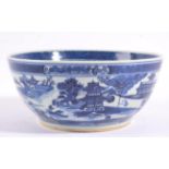 A Chinese Porcelain Bowl, 19th century, painted in underglaze blue with pagodas in a river landscape