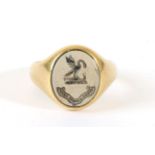 An 18 Carat Gold Sardonyx Intaglio Signet Ring, an oval intaglio seal engraved with heraldic