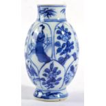 A Chinese Porcelain Miniature Ovoid Vase, Kangxi, painted in underglaze blue with alternate lappet