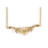 An Early Twentieth Century Seed Pearl and Enamel Necklace, a flower head with a central seed pearl