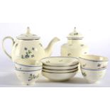 A Creamware Tea Service, circa 1775, painted with Chantilly Sprig within blue line borders,