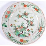 A Chinese Porcelain Circular Dish, Kangxi, painted with famille verte enamels with birds amongst