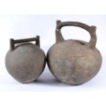 A Chinese Terracotta Wine Flask, in archaic style, of ovoid form with twin spout handle and slip