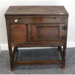 A Joined Oak Food Cupboard, the rectangular top with two extending small leaves above a fielded