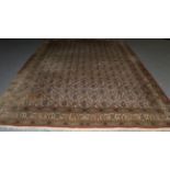 Ghom Carpet Central Iran, circa 1950 The ivory field with a lattice of botehs enclosed by angular