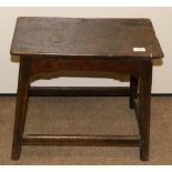 An Early 18th Century Oak Joint Stool, of rectangular form above a shaped apron, on square chamfered