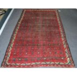 Karabagh Rug Central Caucasus, circa 1900 The compartmentalised field of hooked devices enclosed