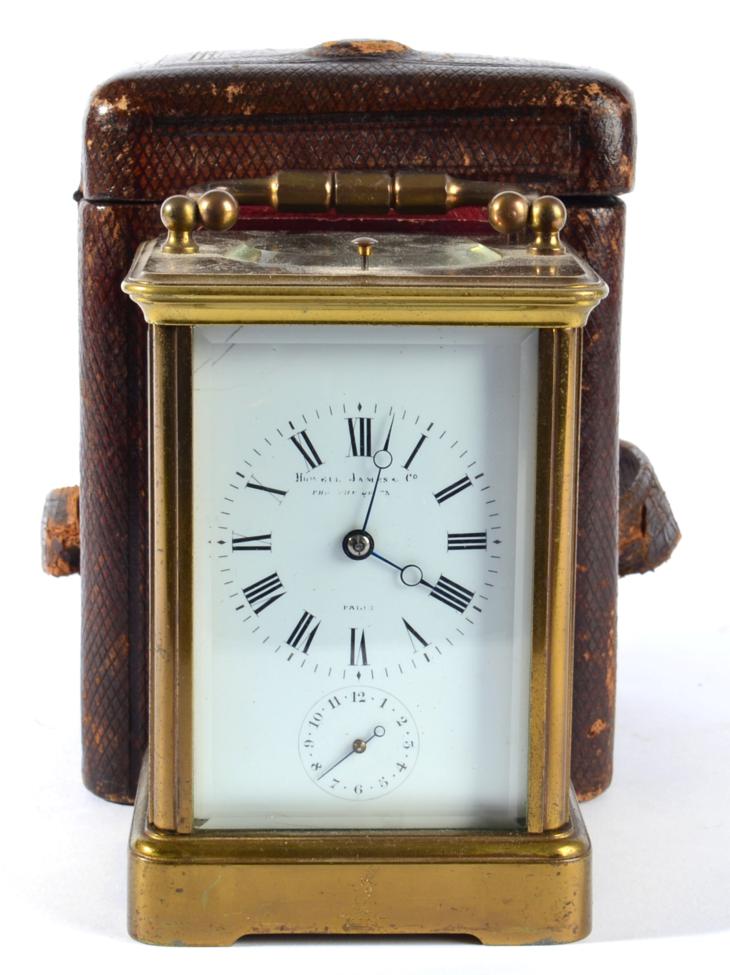 A Brass Striking and Repeating Alarm Carriage Clock, stamped for A Margaine, retailed by Howell