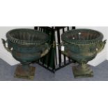 A Pair of Victorian Green Painted Cast Iron Garden Urns, of campana form with scroll handles, cast