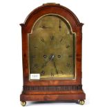 A Mahogany Table Clock, arched pediment with a carrying handle, brass ball feet, 7-1/4-inch one