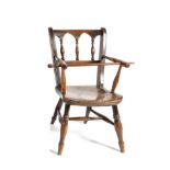 A Late 19th Century Fruitwood and Elm Seated Child's High Chair, with spindle turned arms above a