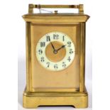 A Brass Striking and Repeating Carriage Clock, circa 1900, carrying handle and repeat button, enamel