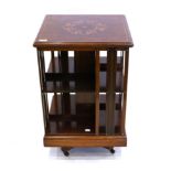 An Edwardian Mahogany Revolving Bookcase, early 20th century, with spindle dividers and moulded