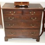 A George III Oak Straight Front Chest, 3rd quarter 18th century, with two short over three long