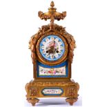 An Ormolu and Porcelain Mounted Striking Mantel Clock, circa 1880, surmounted by an urn finial,