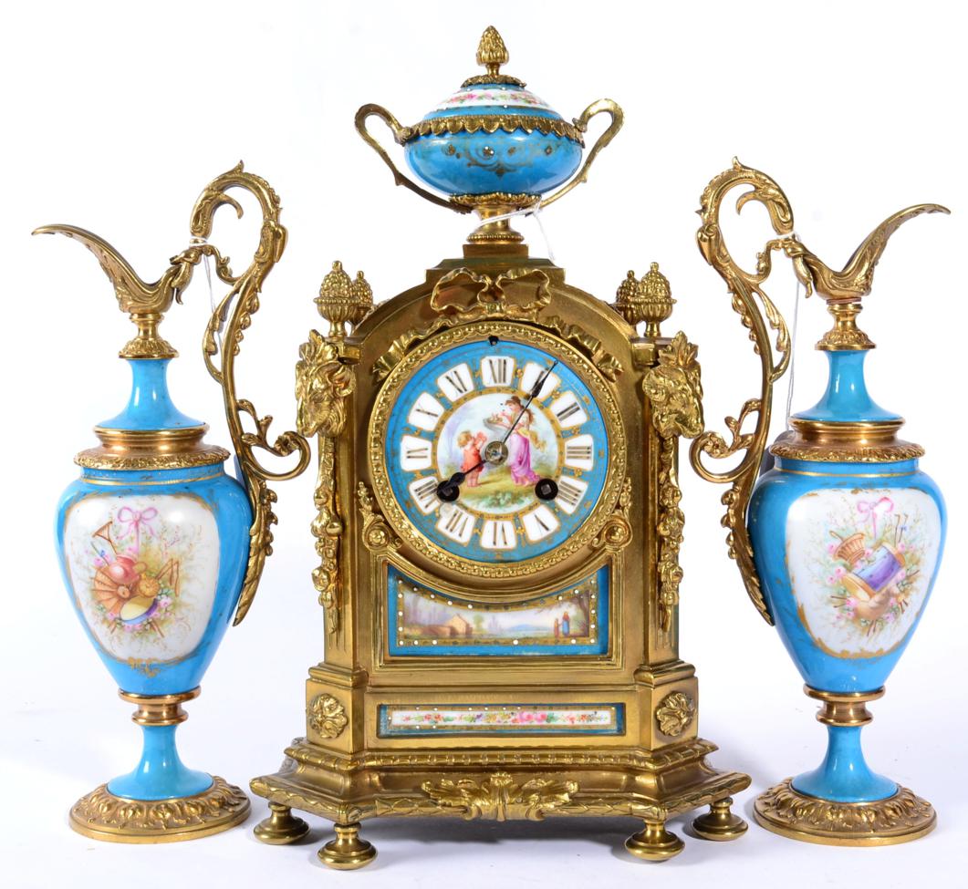 A Gilt Metal and Porcelain Mounted Striking Mantel Clock with Garniture, circa 1890, surmounted with