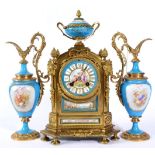 A Gilt Metal and Porcelain Mounted Striking Mantel Clock with Garniture, circa 1890, surmounted with