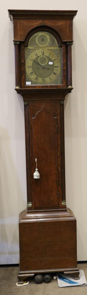 An Oak Eight Day Longcase Clock, flat top pediment, arched trunk door, 12-inch arched brass dial