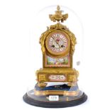 An Ormolu and Porcelain Mounted Striking Mantel Clock, circa 1880, surmounted by an urn finial,