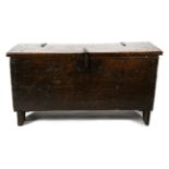 An Early 17th Century Six-Plank Chest, with hinged lid and iron fittings, 112cm by 42cm by 59cm