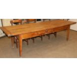 A 19th Century French Cherrywood Farmhouse Table, of plank construction with cleated ends, a