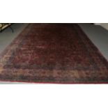 Indian Carpet, circa 1910 The raspberry field with an allover one way design of serrated scrolling