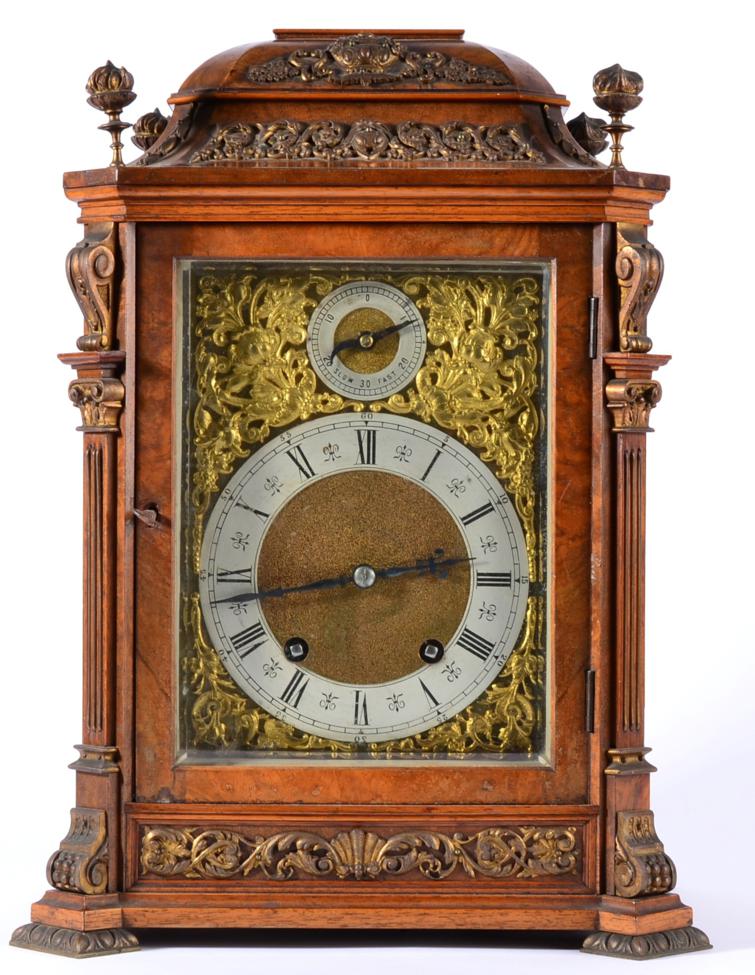 A Burr Walnut Quarter Striking Table Clock, circa 1890, the walnut veneered case with a caddied