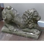 A Stone Figure of a Lion, in Medieval style, the recumbent animal over a ram's head, on a