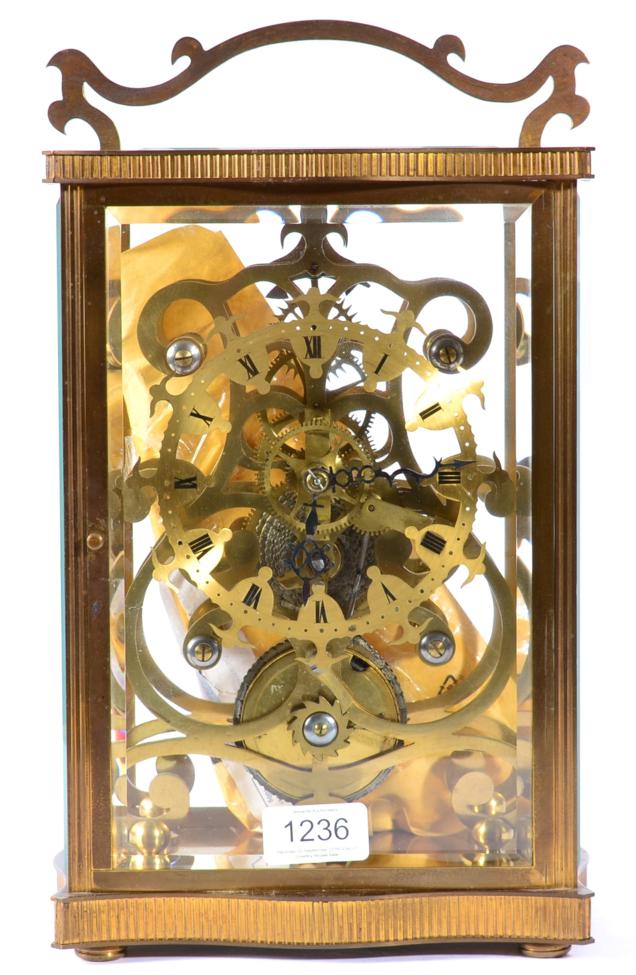 A Brass Cased Skeleton Mantel Timepiece, 20th century, five glass brass case with top carrying