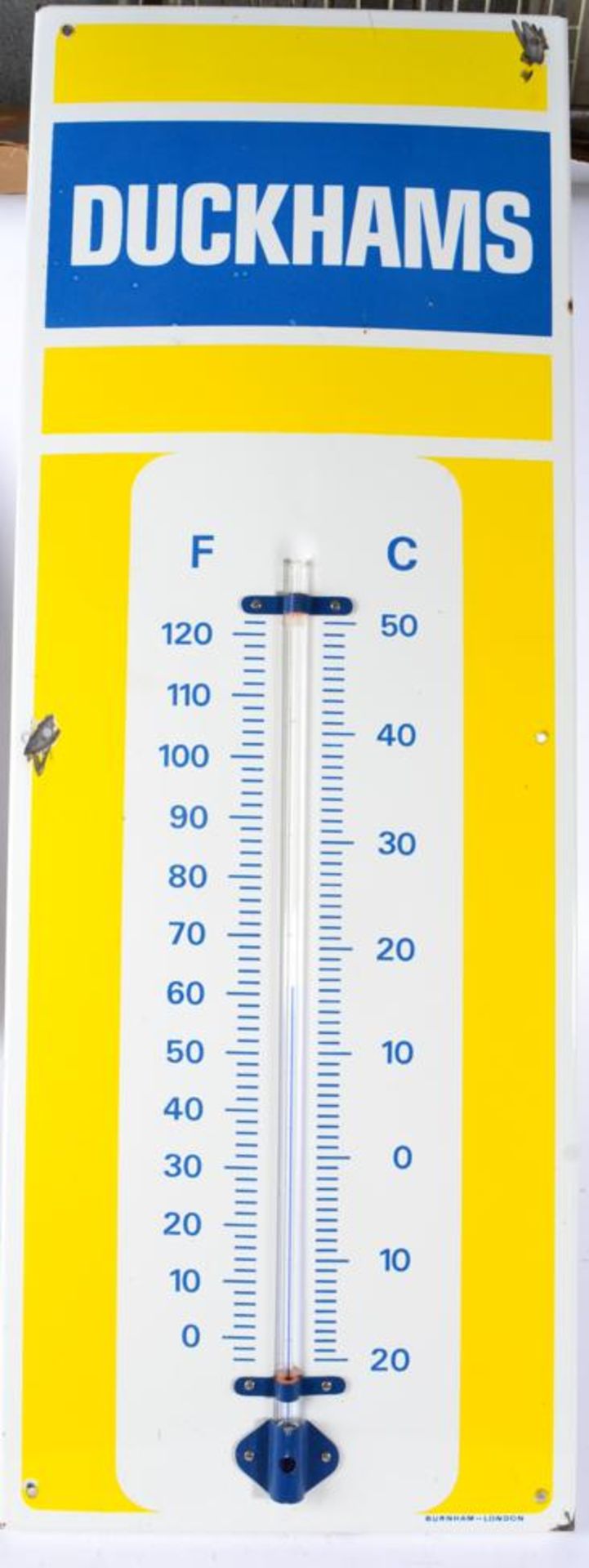A DUCKHAMS Single-Sided Metal Advertising Sign/Thermometer, with six drill holes, the corner printed