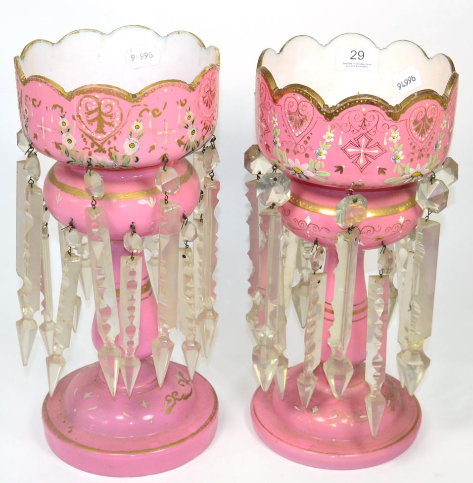 A near pair of pink opaque glass candlestick lustres, 36cm high