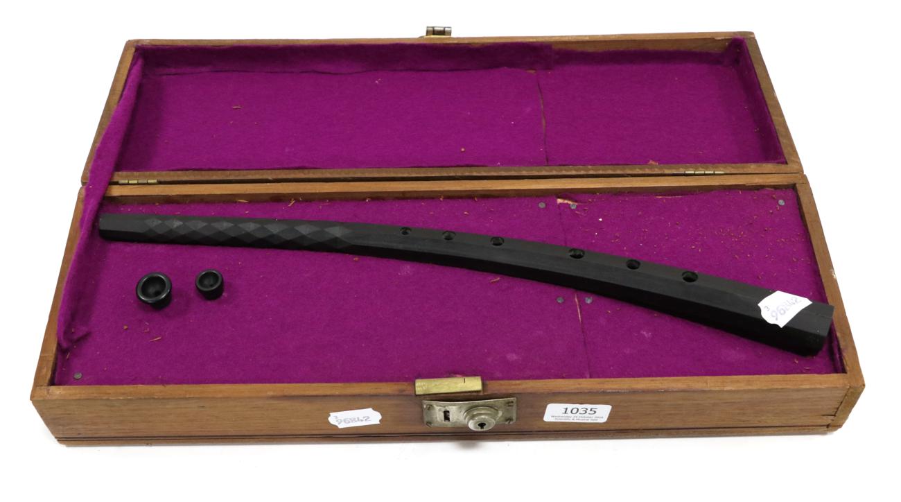 Cornettino replica instrument made from black resin, engraved 'C.W. Monk Pat. No. 1209814', in