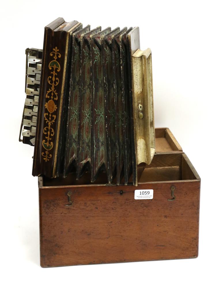 Flutina, 16 treble keys and two bass keys, makers name 'Busson Paris', in mahogany case