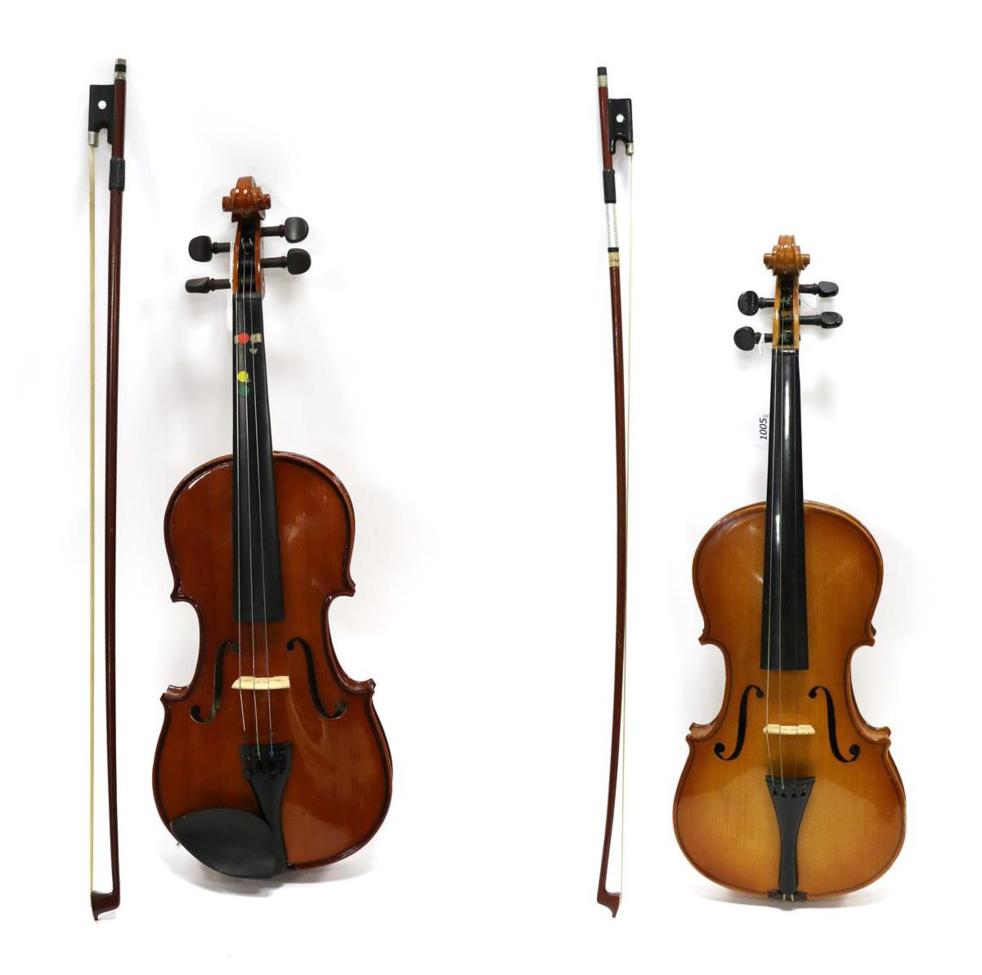 Two Violins one full size one half size, both cased with bows (full size missing chin rest)