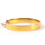 A gold bangle 15.8g. Acid tests as gold