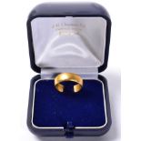 A 22 carat gold band ring, finger size L1/2, 4.8g