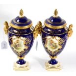 A pair of Coalport twin handled vases and covers