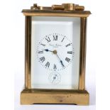 A brass striking alarm carriage clock, 15cm high