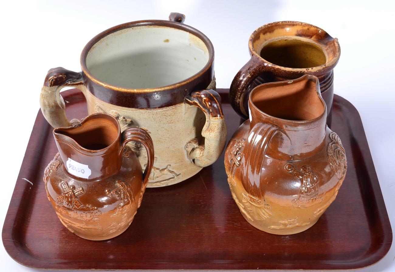 A 19th century salt glazed stoneware tyg; and three similar jugs (4)