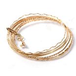 A 9 carat gold multi band bangle, 24g gross