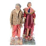 A pair of carved polychromed wooden figures of Gentlemen, possibly Naples, 19th century, one wearing